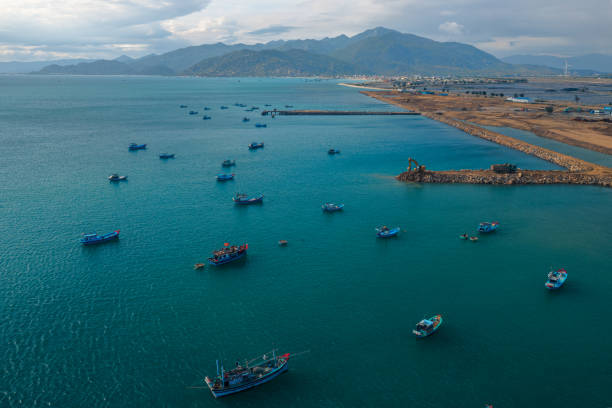 istock Fishing boats are nailing on Cua Be riverfront 1355636261