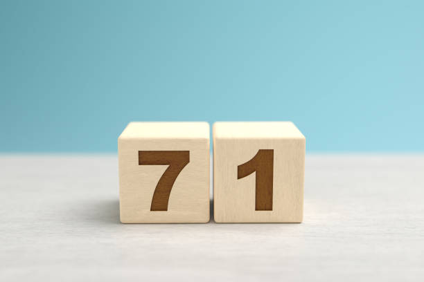 istock Wooden toy blocks forming the number 71. 1355637401