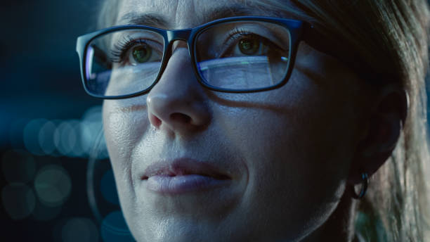 istock Close-up Portrait of Female Software Engineer Working on Computer, Programming Reflecting in Glasses. Developer Working on Innovative e-Commerce Application using Machine Learning, AI, Big Data 1355638825