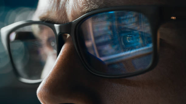 istock Close-up Portrait of Software Engineer Working on Computer, Line of Code Reflecting in Glasses. Developer Working on Innovative e-Commerce Application using Machine Learning, AI Algorithm, Big Data 1355638863