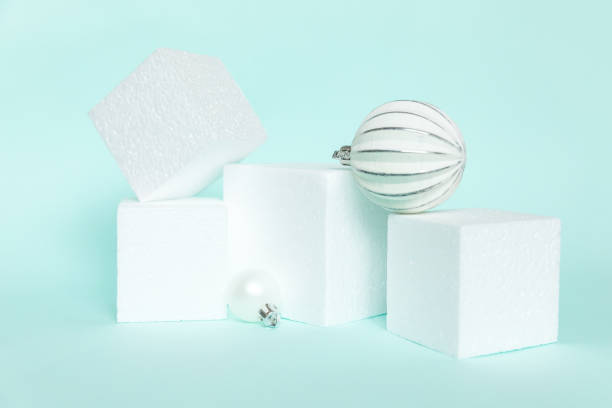 istock Simply minimal composition winter objects ornament and cube shapes geometric form podium isolated blue pastel background. Christmas New Year december time for celebration concept. Mockup, copy space 1355641609