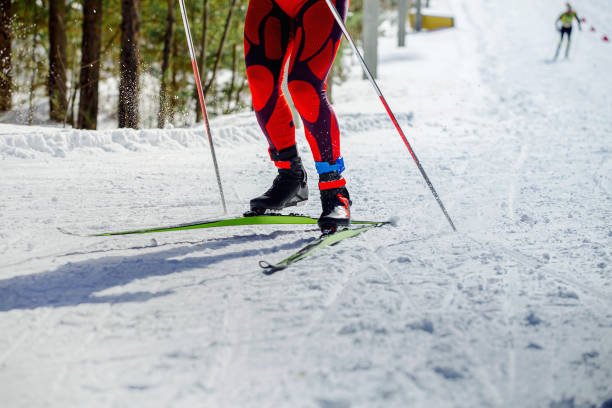 istock legs skier athlete with pole run uphill on ski race 1355641944