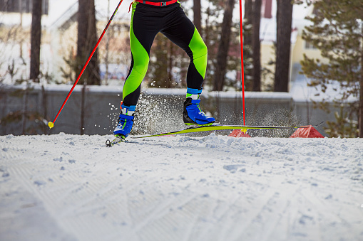 skier athlete running uphill on cross-country skiing