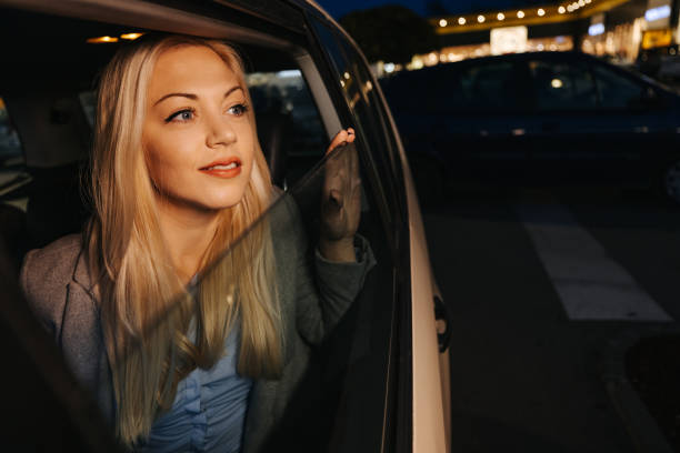 istock Beautiful young woman enjoying night ride 1355641997