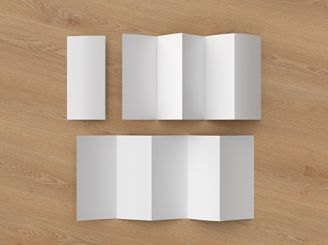 Vertical pages accordion or zigzag fold brochure mock up on wooden background. Five panels, ten pages leaflet. 3d illustration.