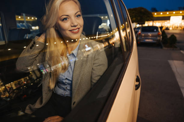 istock Beautiful young woman enjoying night ride 1355642216