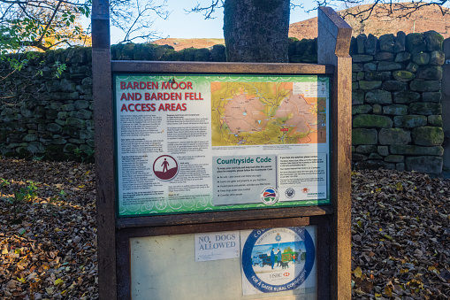 21.11.2021 Barden Bridge, Wharfedale, North Yorkshire, UK. Notice board in Strd Wood showing the way to Barden Moor, Barden Fell and Sions Fell in the Yorkshire Dales