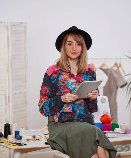 istock Young fashion designer with digital tablet 1355643783