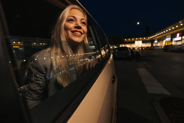 istock Beautiful young woman enjoying night ride 1355644098