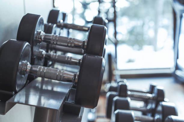 istock Dumbbell in health club 1355647936