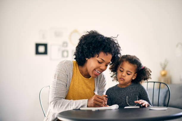 istock Smart little girl, learning her first letters. 1355649600