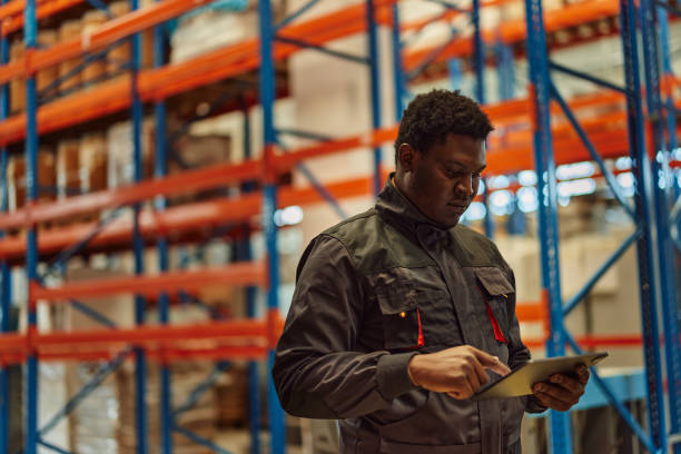istock Focused factory worker, contacting his superior. 1355649724