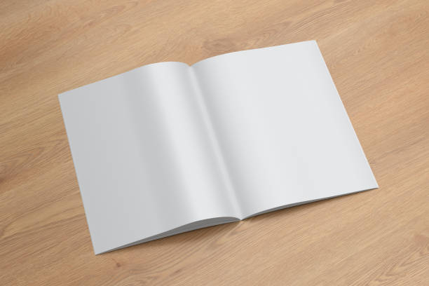 istock Vertical brochure or booklet mock up on wooden background. 1355654361