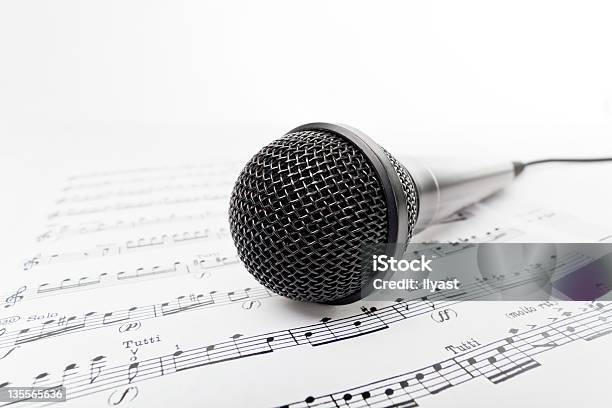 Microphone On Sheet Music Stock Photo - Download Image Now - Black Color, Electrical Equipment, Equipment