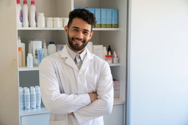 istock Portrait of happy pharmacist 1355658856