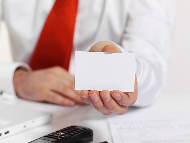 istock Businessman holding business card 135566237
