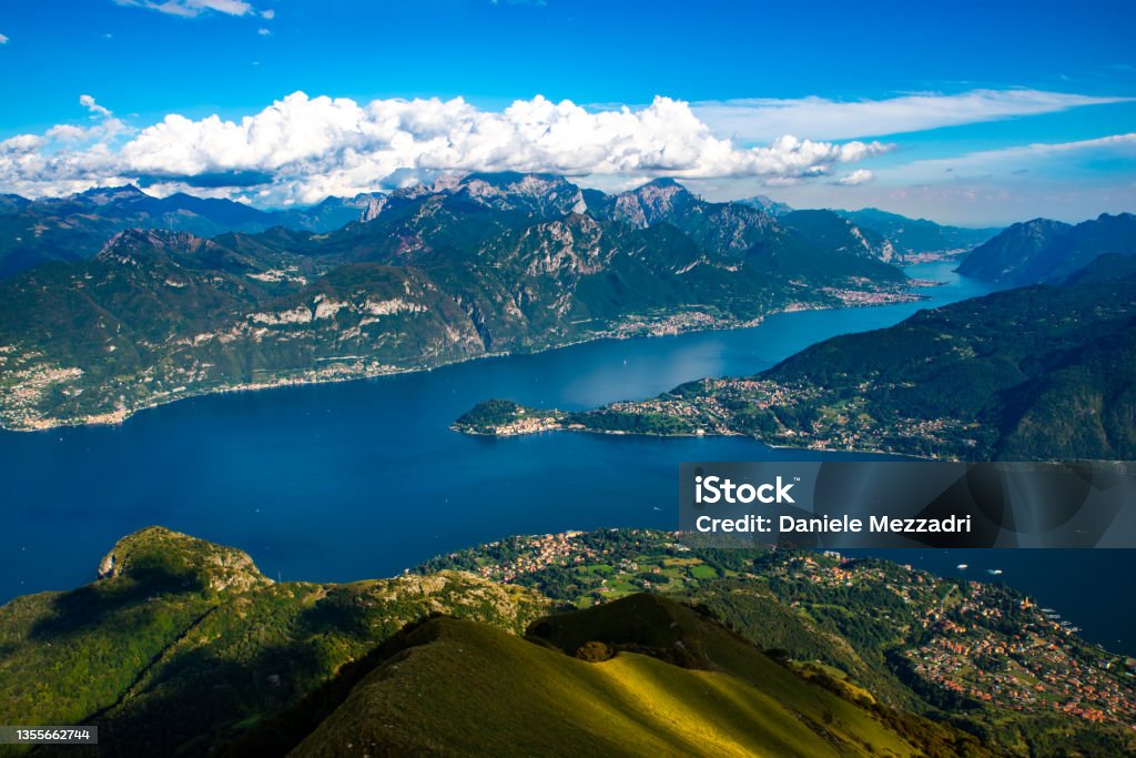 Panorama on Lake Como. The panorama of Lake Como, photographed from Monte di Tremezzo, showing the Northern Grigna, the Southern Grigna, the Lecco branch, the town of Bellagio, and the surrounding mountains. Como - Italy Stock Photo