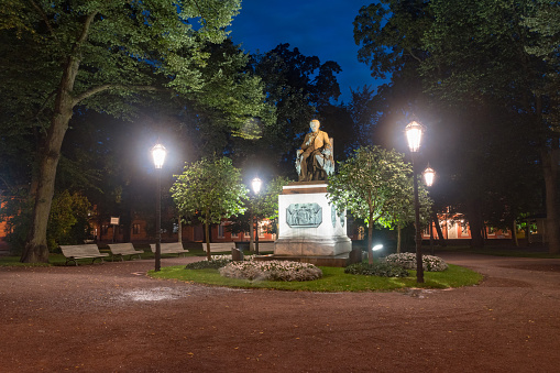 Turku, Finland - August 5, 2021: Night view on Statue of Henrik Gabriel Porthanin.