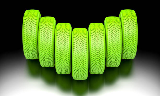 A closeup shot of decorative green colored bicycle wheel on gray background