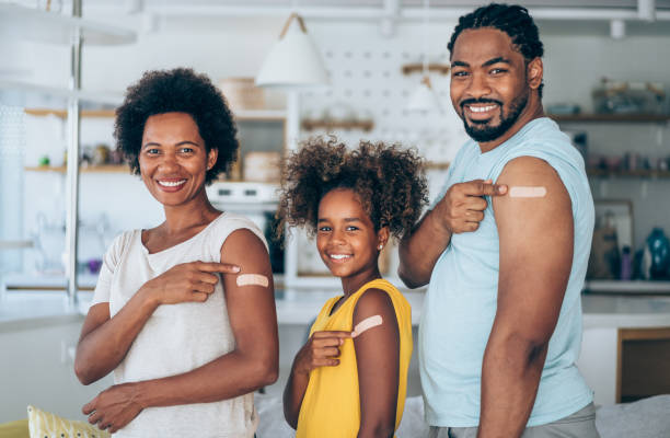 istock Family showing their arms after getting vaccinated. 1355666475