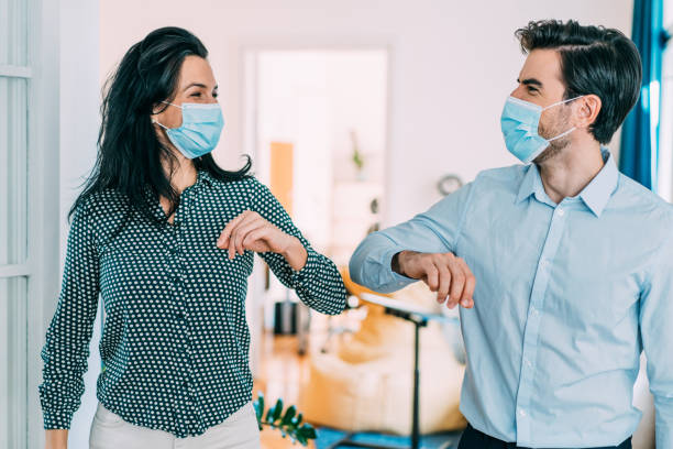 istock Business people greeting during COVID-19 pandemic 1355666556