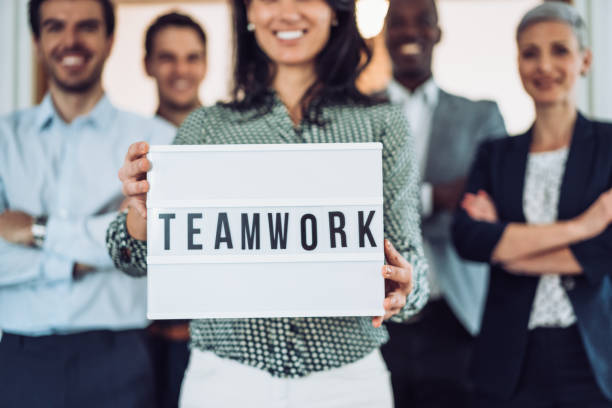 istock Confident businesswoman and her team. 1355666567