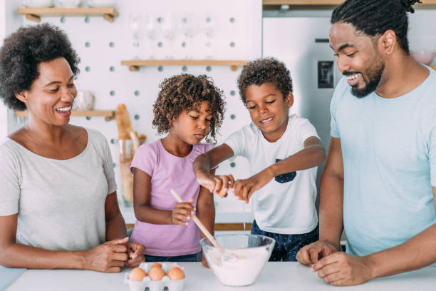 istock Family cooking together. 1355666682