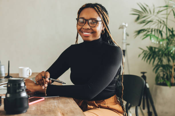 istock Creative young woman smiling at the camera 1355668111