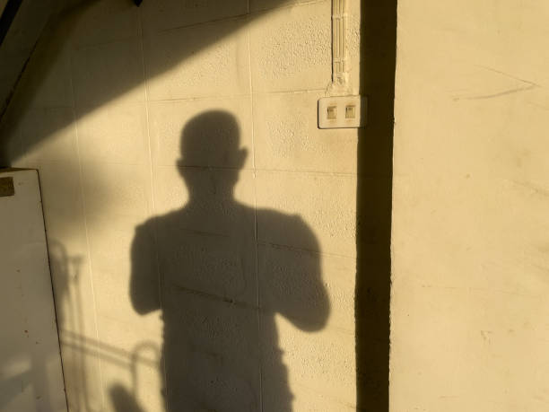 istock Shadow of people on the wall. 1355668638