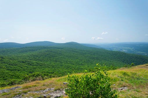 A landscape view of surrounding hills from atop alander mountain along the south taconic trail in mount washington, massachusetts.