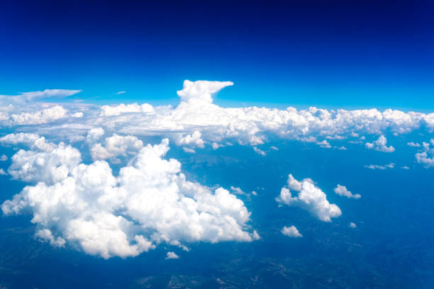 istock Aerial view of sky through airplane window 1355669785
