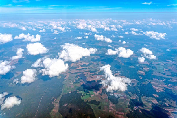 istock Aerial view of sky through airplane window 1355669861