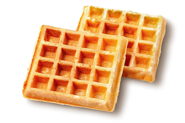 istock Two crispy fried french waffles isolated on white 1355669913