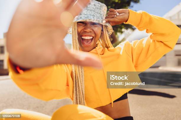 Young Woman Blocking The Camera Stock Photo - Download Image Now - Candid, Outdoors, Hand