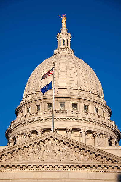 istock State Capitol Building with US and Wisconsin flags 135567306