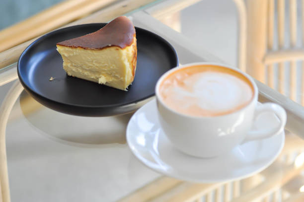 tea or hot tea or milk tea, Thai milk tea and basque burnt cheesecake or basque cheese cake on the table