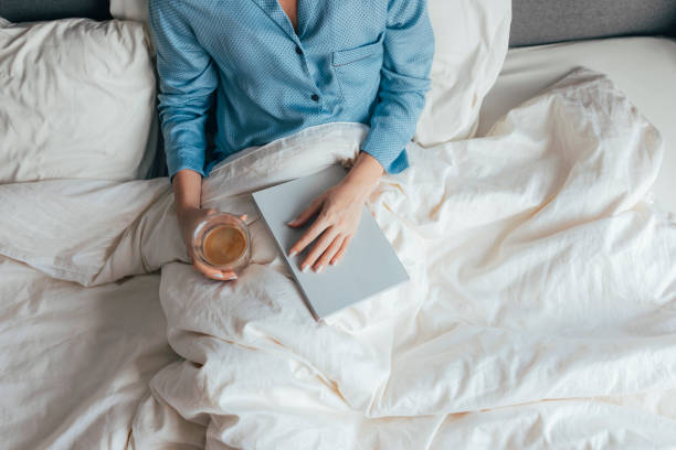istock An Anonymous Student Revising For The Test In Her Bed 1355681597