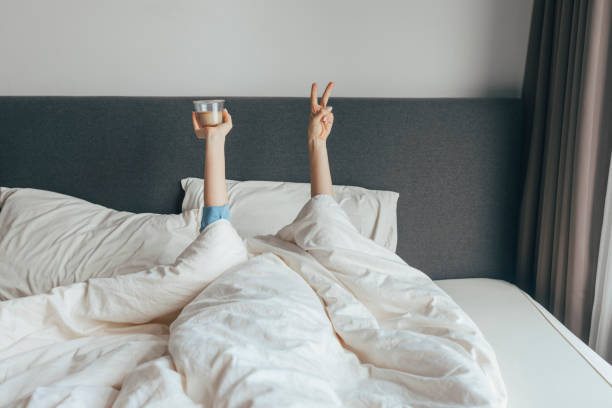 istock An Exhausted Anonymous Woman  Will Get Up After Drinking Coffee 1355681598