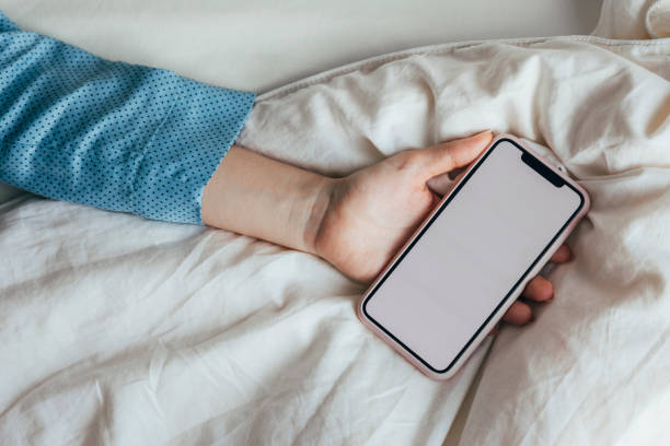 istock An Anonymous Caucasian Person Sleeping With His Smartphone. 1355681612