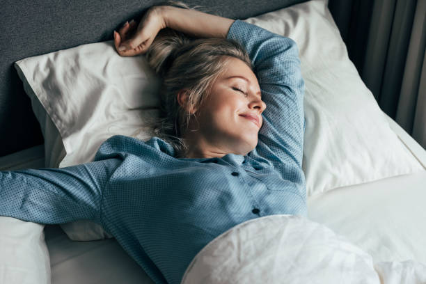istock A Blonde Woman Enjoying Sleeping 1355681625