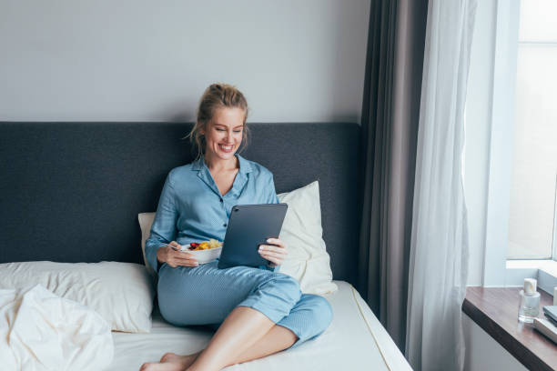 istock A Young Woman Talking On Video Call And Preparing To Have Breakfast 1355681637