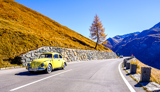 Grossglockner, Austria - October 15: VW beetle at a country road at the Grossglockner Mountain on October 15, 2017