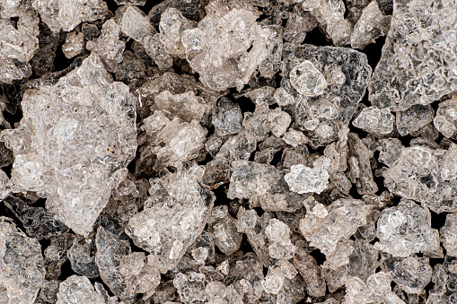 Silver nitrate crystals with pink brownish hue after partially exposed to light, microscopy detail image width 17mm.