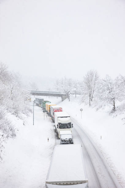 istock Highway in case of snowfall with snow lane and traffic jam 1355687263