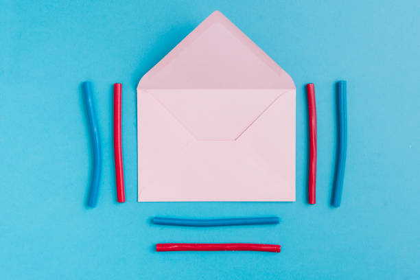 istock Paper envelope and colorful liquorice around it 1355690003