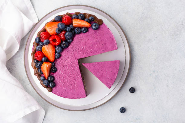 delicious blueberry cheesecake on white plate, light table