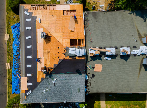 istock Construction worker on renovation roof the house installed new shingles 1355691341