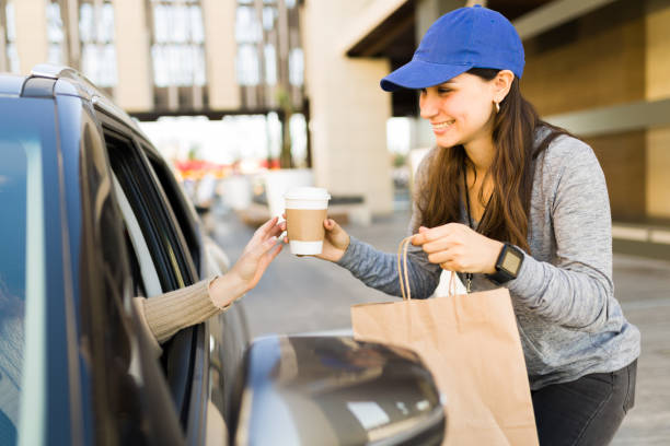 istock Cheerful delivery person working 1355692464