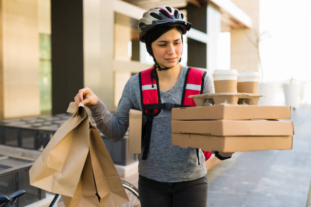 istock Tired delivery person with a lot of work 1355692559