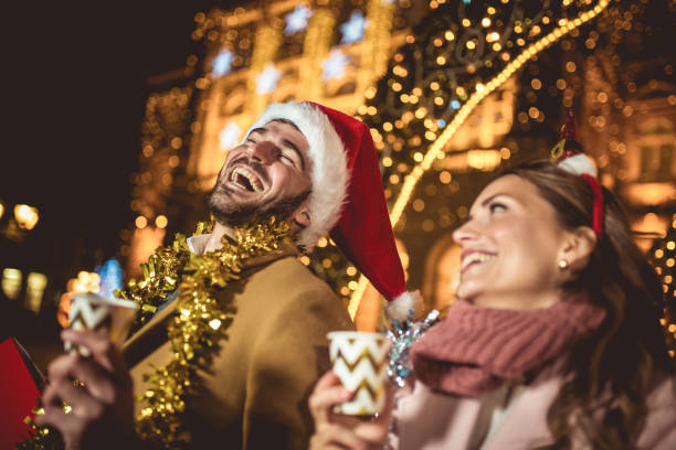 istock Young romantic couple is having fun outdoors before Christmas. 1355693654